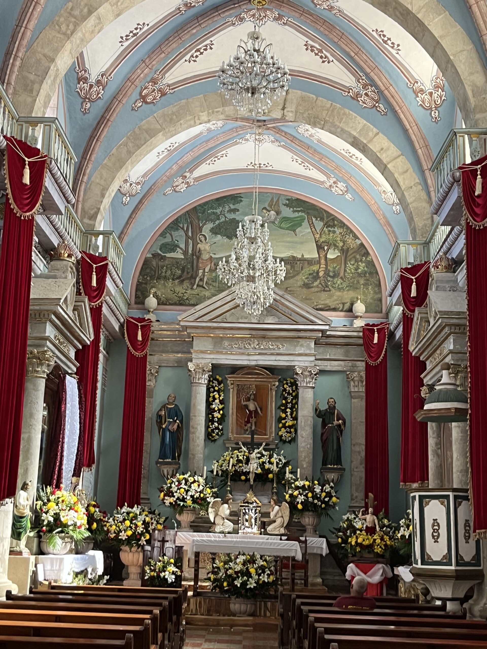 Charming church interior with floral decorations.